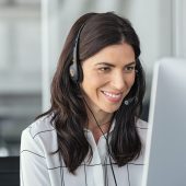 Smiling latin woman in call center